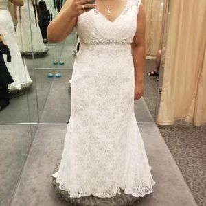 NEVER WORN outside of trying on. comes with veil and slip. Asking $2000.00 OBO